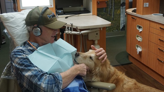 Patient petting Therapy Dog Chance